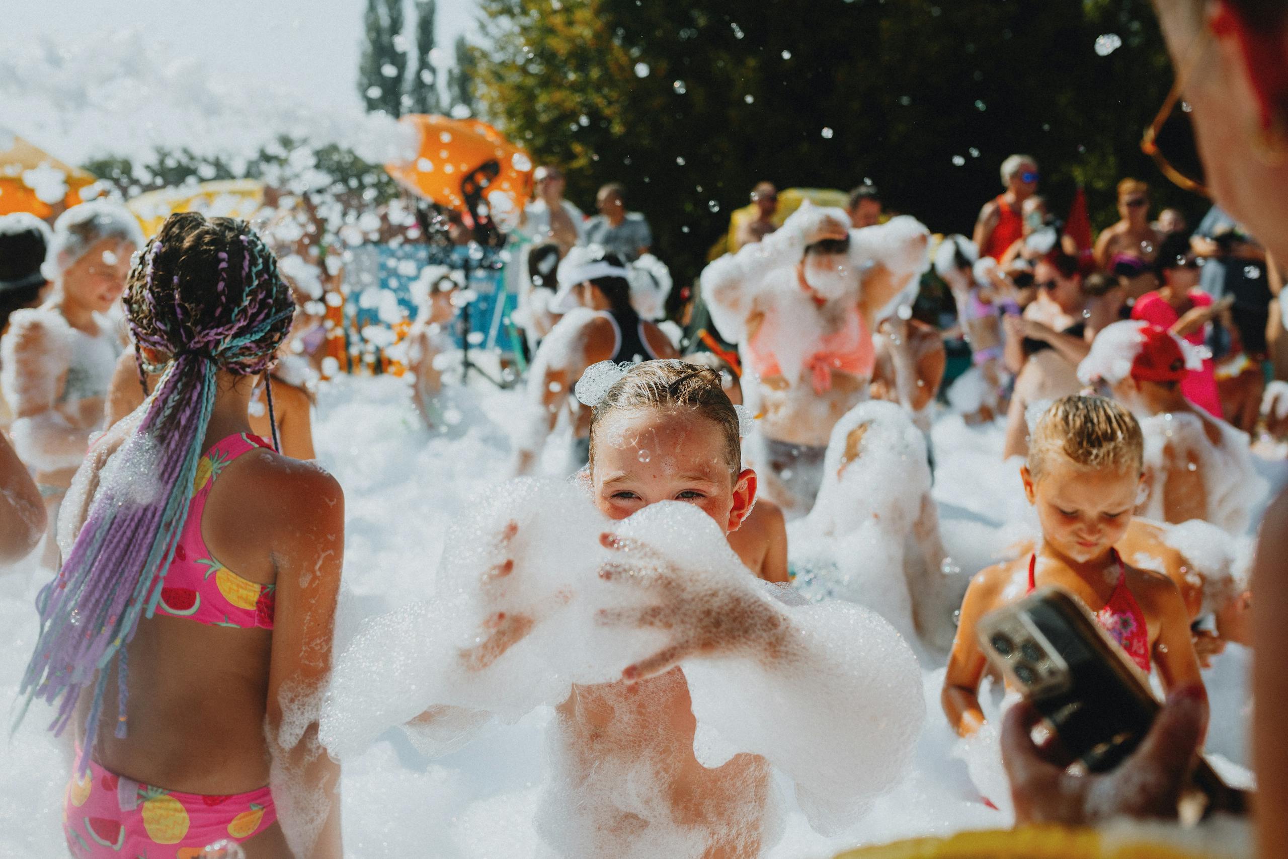 A group of children playing in foam